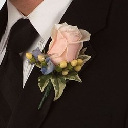 Soft pink rose boutonniere from your Sebring, Florida florist