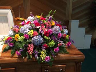 Uplifting Spring Casket Spray from your Sebring, Florida florist